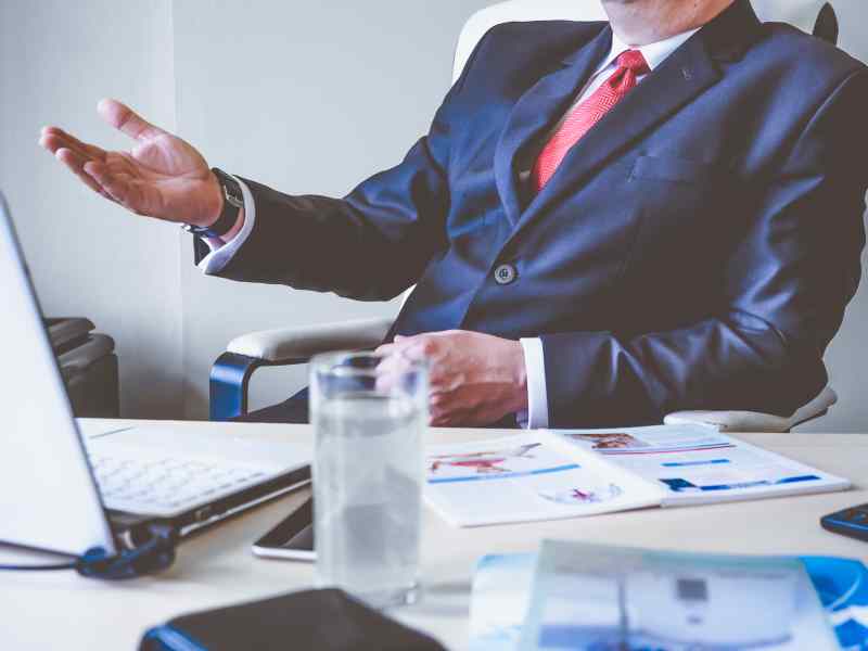 man in suit at a desk